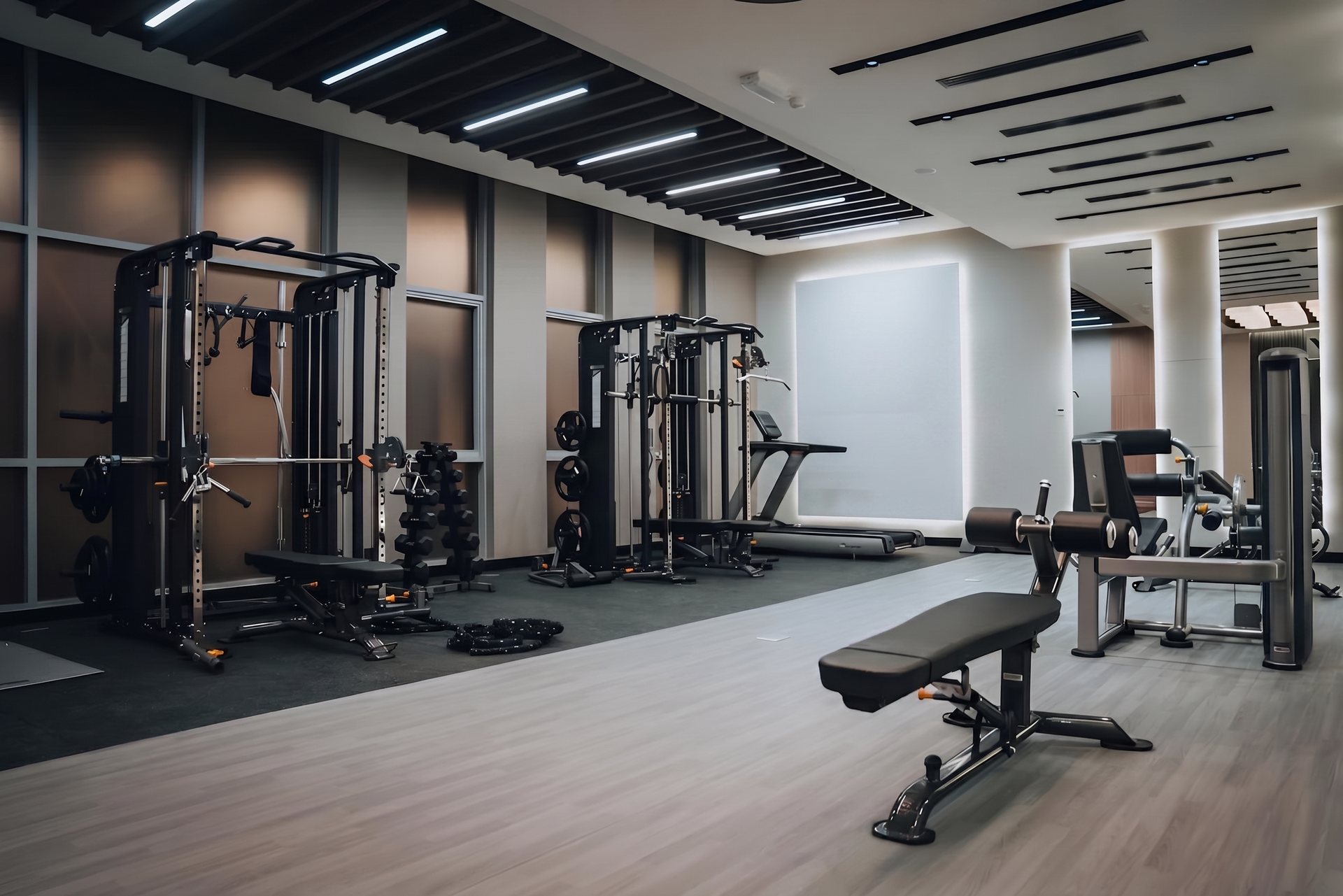 Premium gym floor — rubber, steel & warm light